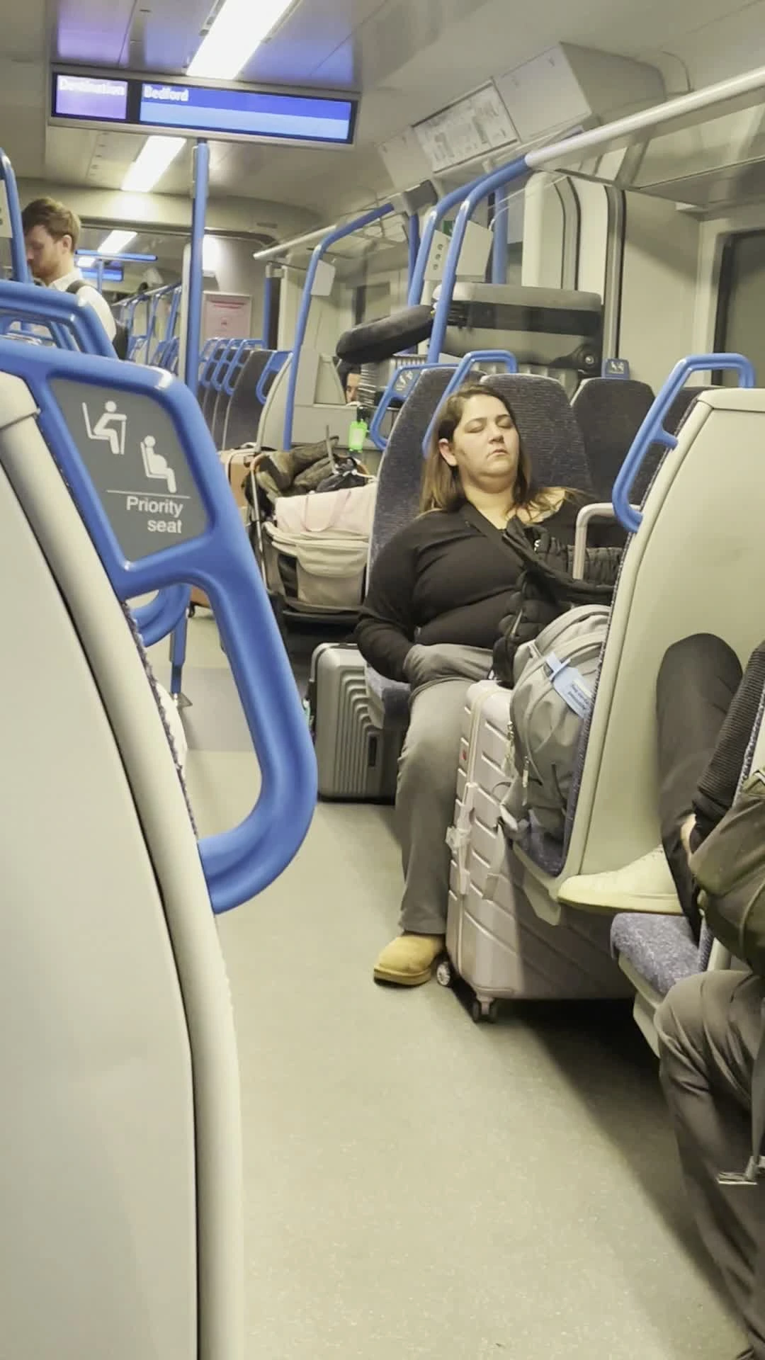 Person sleeping on train
